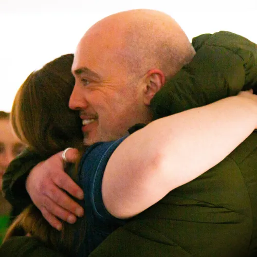 Two people sharing a warm embrace