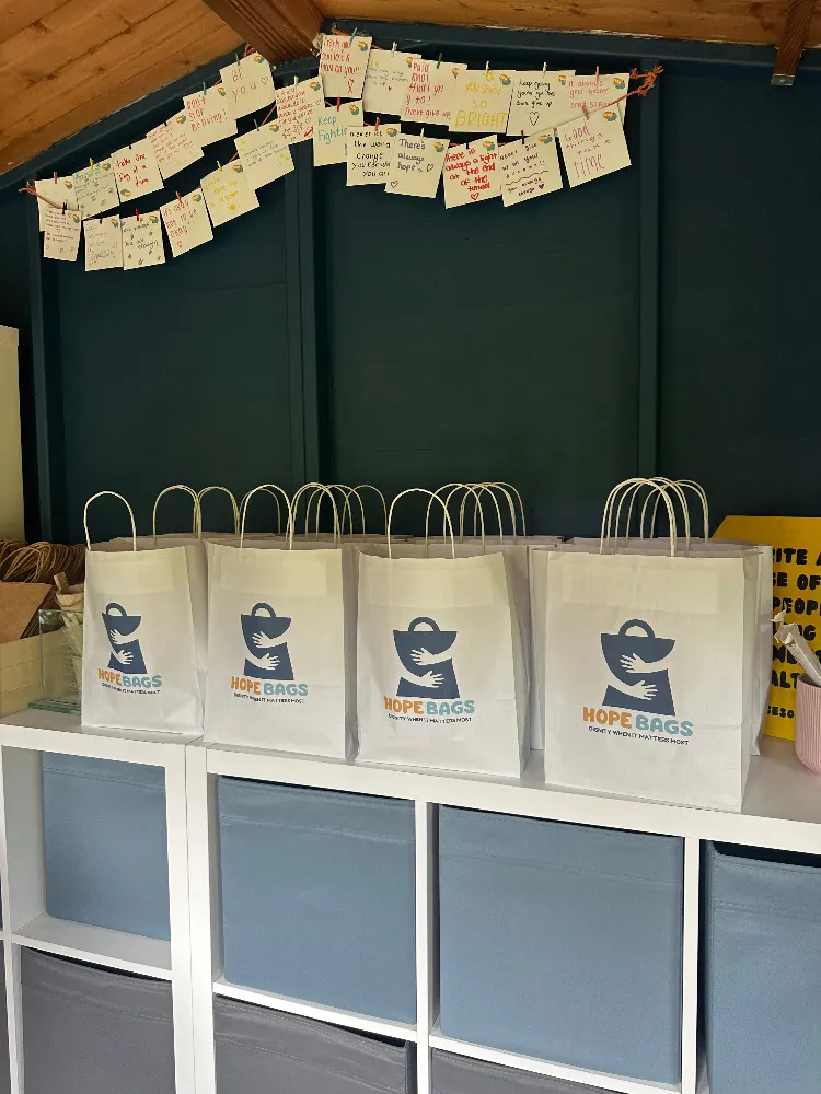 A row of packed Hope Bags with the foundation’s logo, ready to be delivered to a psychiatric ward